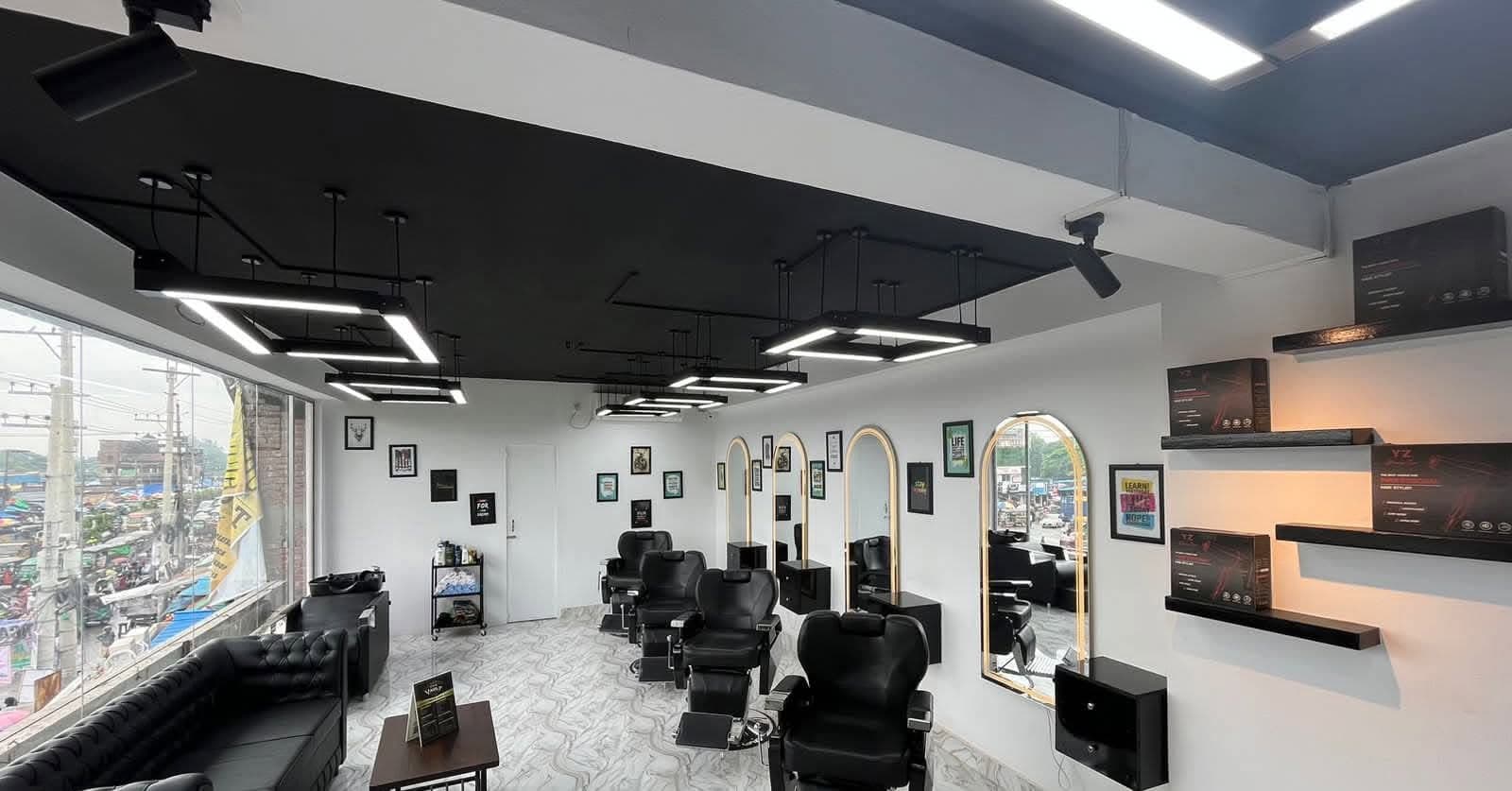 Inside The Vault barber shop at Kaptai Rastar Matha, Chattogram: black barber chairs and gold-framed mirrors